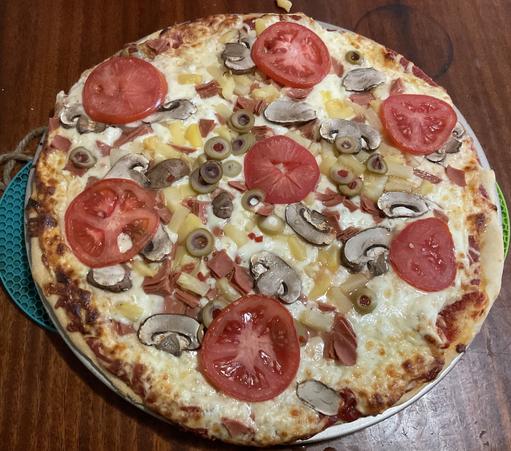 vegetarian ham, pineapple, mushrooms, olives, tomatoes.