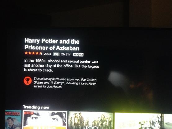 A photo of Netflix on our TV in 2016. It shows the title for "Harry Potter and the Prisoner of Azkaban" but the description of the movie reads "In the 1960s, alcohol and sexual banter was just another day at the office. But the façade is about to crack."