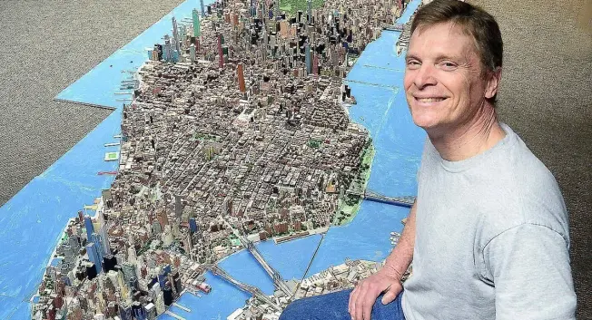 Joseph Macken, 63, with his scale model of Manhattan