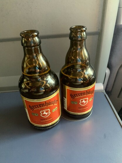 2 bottles of Herrenhäuser Spezial beer on the seat table
