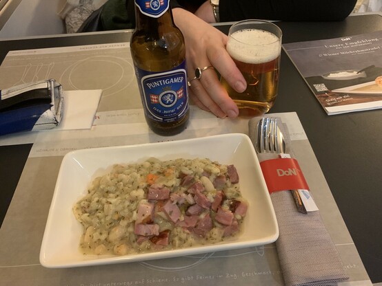 Weird looking austrian food with a nice austrian beer
