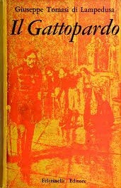 The Italian cover of Giuseppe di Lampedusa's The Leopard (Il Gattopardo), done entirely in yellow and red tones

On the bottom left ther's a young man in 19th century uniform, putting his weight on a cane. Some distance behind him, across a tiled floor are three figures bowing towards the man. One of them is a woman in a dress with a stole over her shoulders, the other two are less clear.

Right at the back is a gate and the texture of bushes, indicating that this tableau is set in a courtyard somewhere