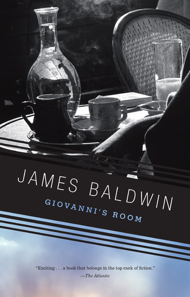 The cover of James Baldwin's book Giovanni's Room

It shows a black and white photo of a man sitting at a cafe table. The photo is framed so that the table is in focus, and only the hand and a bit of the coat of the man is visible